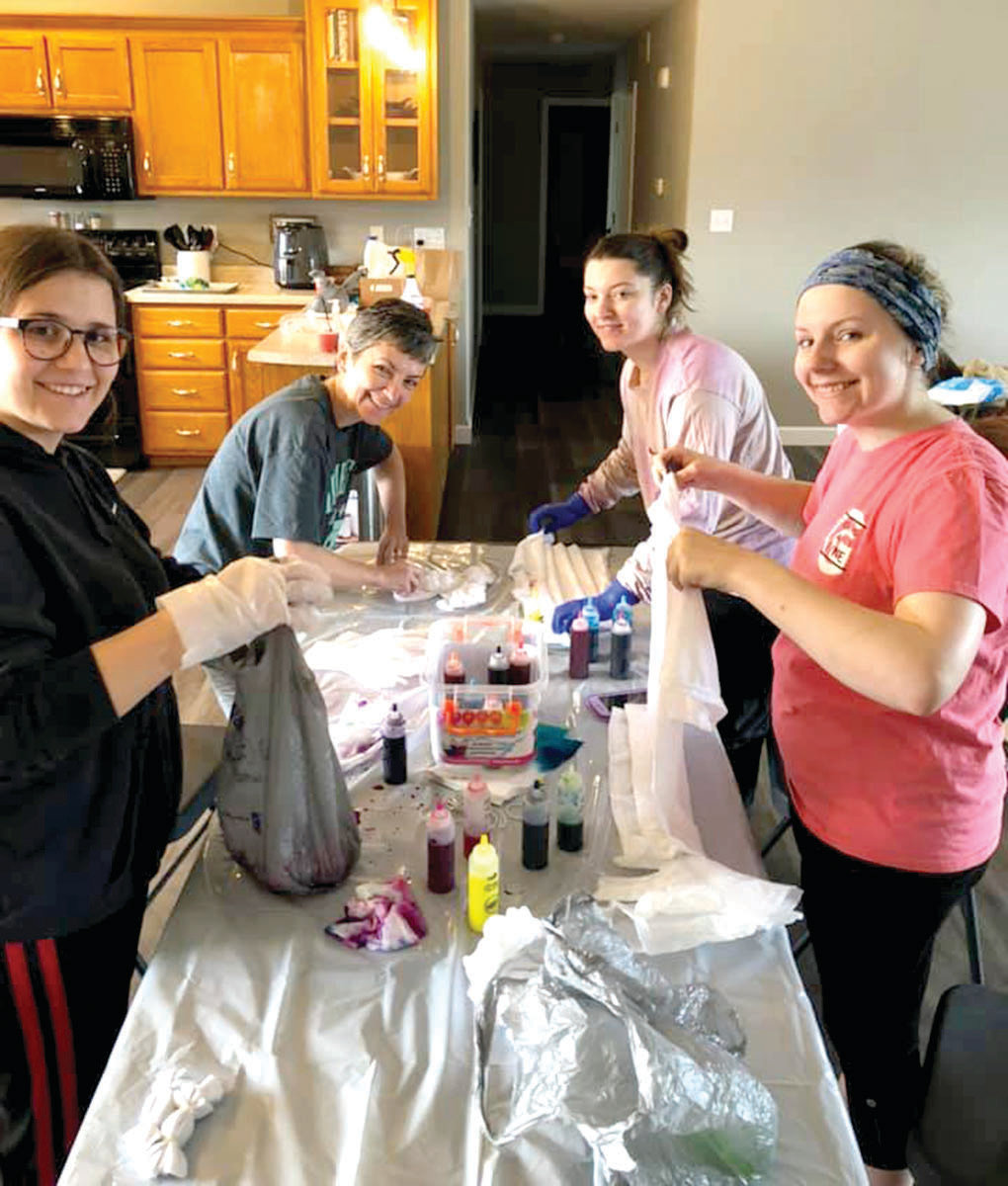 Sherry Cleveland, Shelby Cleveland, Savannah Cleveland and Arianna Cingolani tie-dye some new shirts. Not pictured is Frances Boswell.