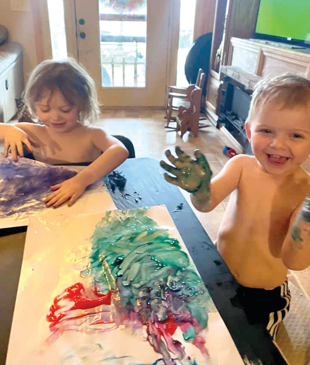 Rylee and Lucas Sneller have fun finger-painting while school is out.