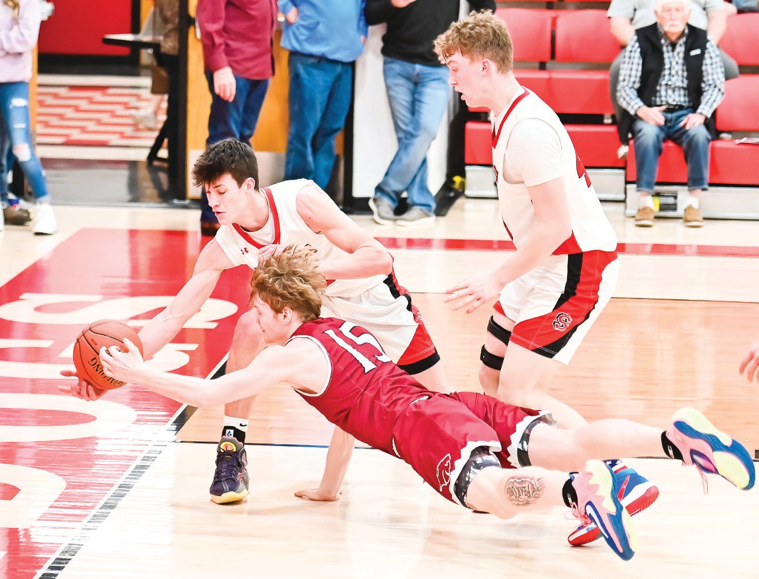 Senior Zach Dodson dives for a loose ball. He posted 11 points and 10 rebounds on the night.