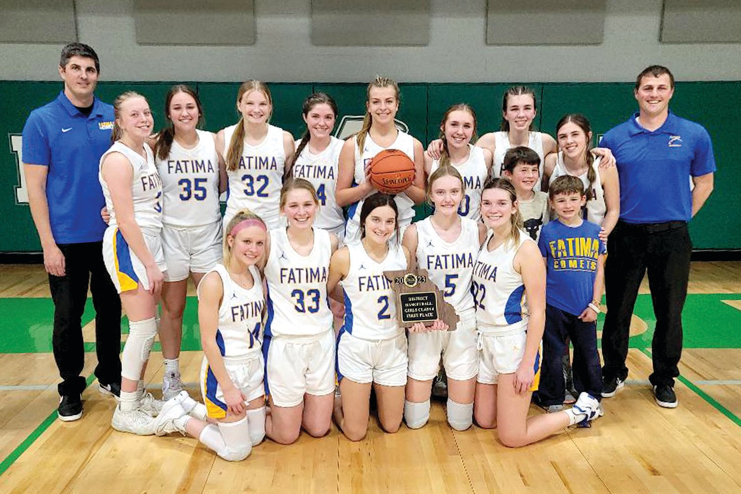 The Lady Comets claimed their first district title since 2014 with Saturday’s win over Eldon. Team members are, from left to right, front row, Kaitlyn Plassmeyer, Lydia Brunnert, Claire Bexten, Emma Bower, Ellie Brune, and Lincoln Baker; and in the back row, Coach Matt Baker, Kristen Robertson, Payton Wieberg, Madelyn Backes, Lucy Crede, Alli Robertson, Alex Berhorst, Vivian Bax, Natalie Wilbers, and Asst. Coach John Fick.