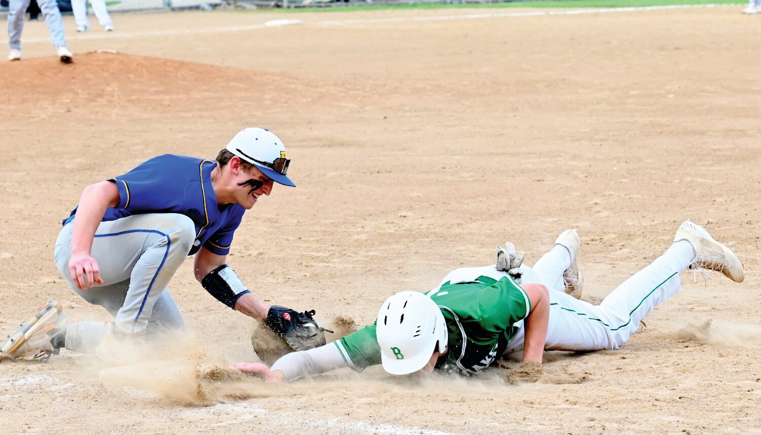 Fatima first baseman Jacob Schulte applies a late tag on a pickoff attempt during Thursday’s 3-0 win over Blair Oaks.