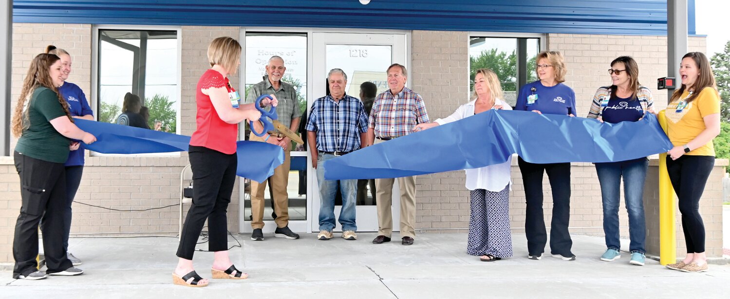 Osage County Health Department Administrator Kim Sallin cuts the ceremonial ribbon at Friday’s Grand Opening for the new building. She was joined by OCHD employees and Western District Commissioner Larry Kliethermes, Eastern District Commissioner John Trenshaw, and Presiding Commissioner Darryl Griffin.