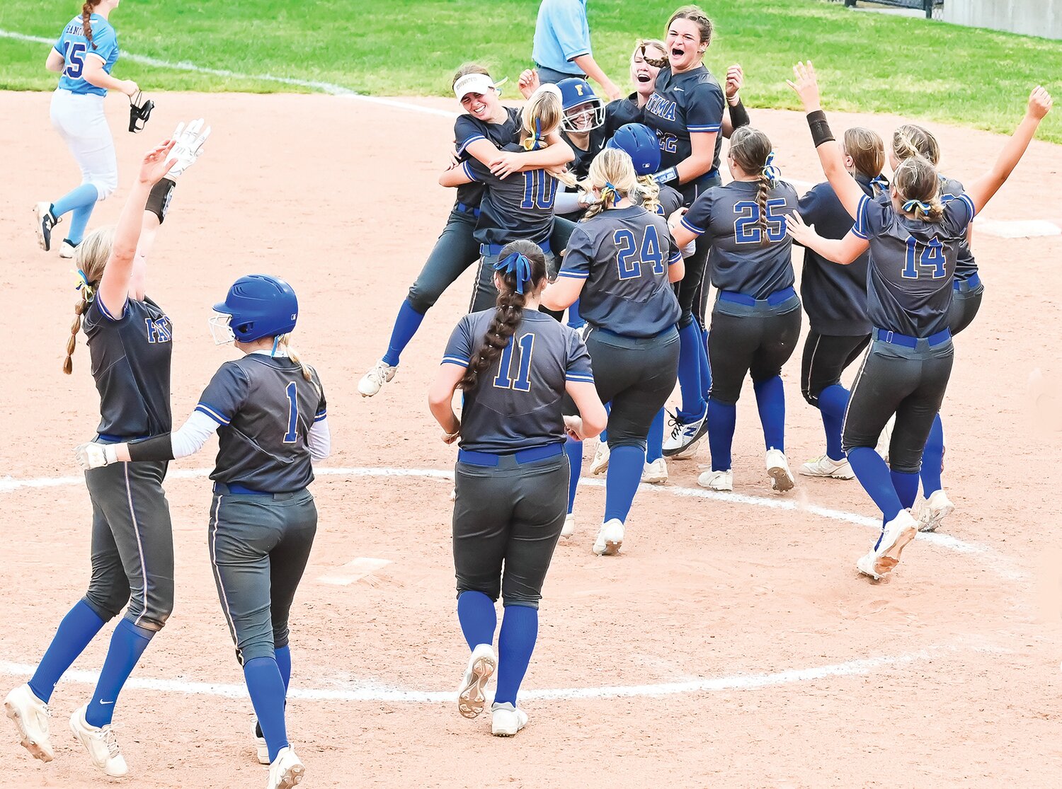 Fatima players rush the field in celebration after winning Friday’s Class 3 championship game, 12-2, in five innings over St. Francis Borgia. This is the second straight title for the Lady Comets.