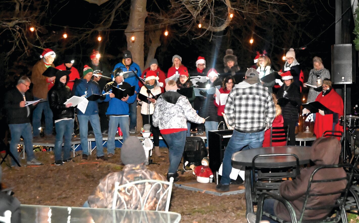 Carolers offering Yuletide greetings before the Christmas tree-lighting ceremony.